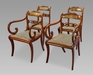 A Very Rare Long Set of Sixteen George III Brass Inlaid Dining Chairs
