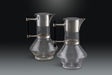 Fine and Rare Pair of Christopher Dresser Silver Plated Ebony and Glass Wine Decanters, 1881 for Hukin & Heath
